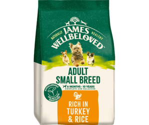 White background with a bag of James Wellbeloved Small Breed Turkey & Rice Dog Food. Packaging is green and cream with small breed 3 dogs pictured, with text 'Adult Small Breed, Dog 6 months - 10 years, Rich in Turkey and Rice'.