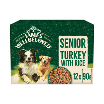 White background with a box of James Wellbeloved Turkey with Rice Senior Dog Wet Food. The box is green and cream with 2 adult dogs pictured on the box.