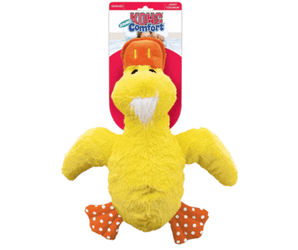 White background with a KONG yellow plush duck dog toy with an orange beak and feet, attached to a cardboard backing.