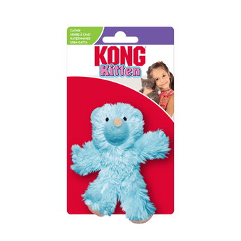 Fluffy blue teddy bear cat toy with stitched eye details and beige nose attached to white and red cardboard backing which pictures a girl holding a kitten, text at top reads 'KONG Kitten'.