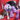 Black and white collie with a Pale purple soft fabric and rope Sloth KONG Dog Toy with a blue eyes and purple feet in the dog's mouth, pictured sitting in a red chair.