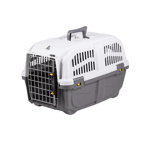 White background with a Krusse Skudo size 2 Travel Crate. The crate is light and dark grey plastic with a closed metal door.