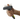 White background with a hand holding a small black plastic brush with green grip handle and a metal comb teeth, the thumb is pressing onto the metal bristles.