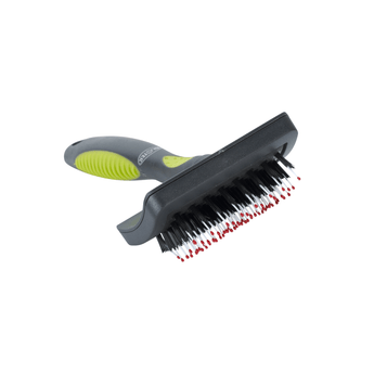 White background with a small black plastic brush with green grip handle and plastic bristles with red tips pictured.