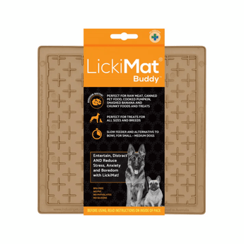 White background with a Coffee VLickiMat Buddy slow feeder mat with a criss-cross surface. The Playdate mat is in black and orange packaging cardboard packaging.