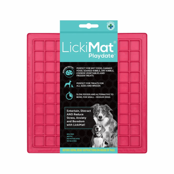 White background with a pink LickiMat Playdate slow feeder mat with a square grid surface. The Playdate mat is in black and blue packaging cardboard packaging.