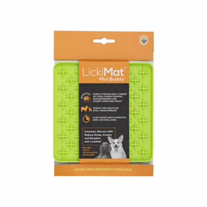 White background with a green LickiMat Mini Buddy slow feeder mat with a criss-cross surface. The Playdate mat is in black and orange packaging cardboard packaging.