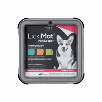 White background with a grey LickiMat Mini Keeper for slow feeding mats. The Keeper has a black sticker inside with a Corgi pictured and compatible feeding mats.
