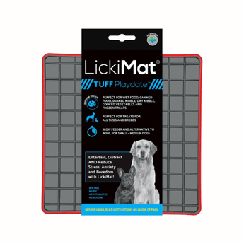 White background with a red LickiMat Tuff Playdate slow feeder mat with a grey square grid surface. The Playdate mat is in black and blue packaging cardboard packaging.
