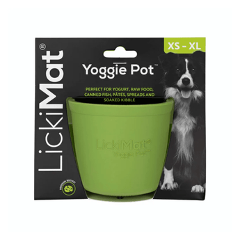 White background with a green LickiMat Yoggie Pot slow feeder. The Yoggie pot is in black cardboard packaging.