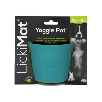 White background with a turquoise LickiMat Yoggie Pot slow feeder. The Yoggie pot is in black cardboard packaging.
