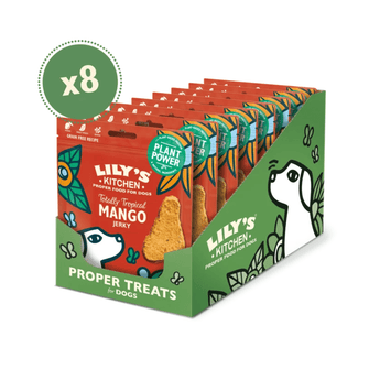 A retail display box of Lily's Kitchen Plant Based Mango Jerky dog treats, showing eight individual red and green snack pouches arranged in a cardboard counter display. A green circular 'x8' badge is overlaid in the top-left corner.