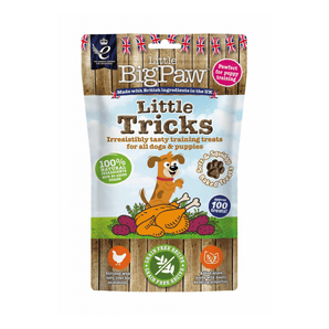 White background with a packet of Little BigPaw 'Little Tricks' dog treats. Pictured on the packet is an illustration of a brown dog with a cooked chicken and vegetables in the foreground. Text on the bag says 'Irresistibly tasty training treats for all dogs & puppies, 100% natural ingredients, soft & squidgy baked treats. Approx. 100 treats!'