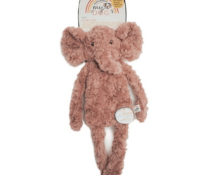 Dusky pink elephant shaped dog toy with long arms and legs, stitched detail eyes with tags attached to top and mid-section. Pictured on a white background.
