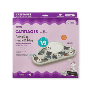 Nina Ottosson Catstages Rainy Day Puzzle & Play toy in its original retail packaging, featuring a purple and lavender box with an illustration of the cat-shaped puzzle piece set.