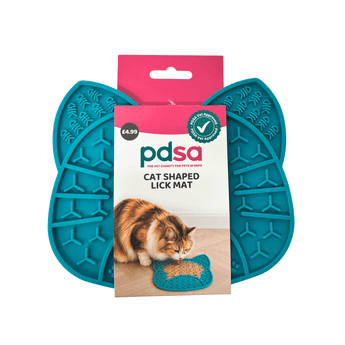 Teal-colored PDSA cat-shaped lick mat shown both flat and packaged with its retail card in the center, on a plain white background.