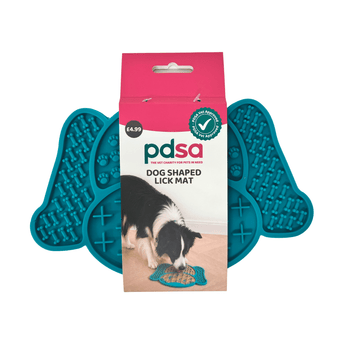 PDSA dog shaped lick mat shown in its retail packaging, with two teal silicone lick mats visible behind the pink and white box on a white background.