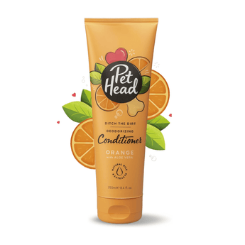 White background with an orange bottle of Pet Head Ditch the Dirt conditioner for dogs. On the bottle is illustrated coconuts, leaves and a dog bone with text 'Ditch the Dirt, Deodorising, Conditioner, Orange with Aloe Vera'.