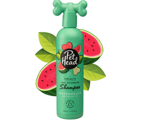 White background with a green bottle of Pet Head Furtastic shampoo for Dogs. On the bottle is illustrated watermelons, leaves and a dog bone with text 'Furtastic, Knot Detangler Shampoo, Watermelon with Shea Butter'.