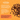 Promotional graphic for Pet Munchies Natural Pet Treats showing cubical duck treat pieces on a bright orange background with product text promoting the features of the treats.