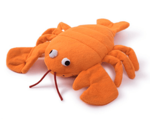 Orange plush dog toy on a white background.