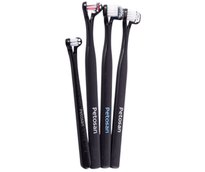 White background with a four black doubled headed toothbrushes for dogs pictured.
