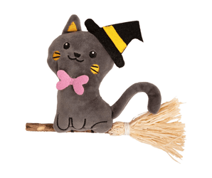 A Rosewood Witchy Kitty plush toy, a grey cat wearing a black and yellow witch hat and a pink bow tie, sitting on a Silvervine straw broomstick against a plain white background.