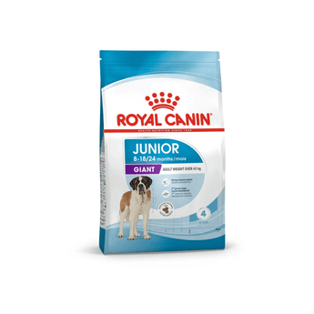 White background with a blue bag of Royal Canin Junior Giant dog food. Pictured on the bag is a young St. Bernard, text on the bag states '8-18/24 months' and 'Giant, Adult Weight over 45kg'.