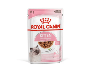 White background with a sachet of Royal Canin Kitten chunks in gravy. Pictured on the packet is a Ragdoll kitten, text on the tin states 'Up to 12 months'.
