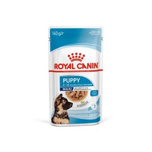 White background with a sachet of Royal Canin Maxi Puppy in gravy. Pictured on the packet is a puppy, text on the tin states '2 -15 months'.