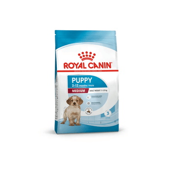 White background with a blue bag of Royal Canin Medium Puppy. Pictured on the bag is a spaniel puppy , text on the bag states '2 - 12 months' and 'Medium, Adult Weight 11-25kg'.