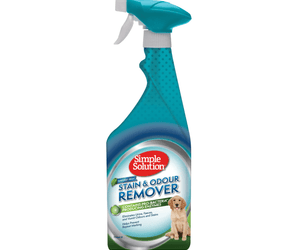 White background with a spray bottle of Simple Solution Stain & Odour Remover - Rainforest Fresh, on the bottle is a picture of a Labrador puppy.
