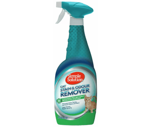 White background with a spray bottle of Simple Solution Cat Stain & Odour Remover, on the bottle is a picture of a ginger kitten.