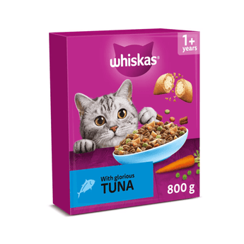 White background with a purple box of Whiskas Tuna dry food, on the box is silver tabby cat in front of a bowl on food. Text on the box reads 'Whiskas, 1+ years, with glorious tuna, 800g'.