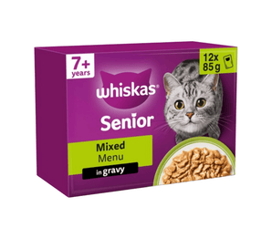 White background with a purple box of Whiskas Mixed Menu on the box is silver tabby cat in front of a bowl on food. Text on the pack reads 'Whiskas, 7+ years, Mixed Menu, in Jelly, 12x85g'.