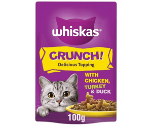 White background with a purple packet of Whiskas Crunch!, on the packet is silver tabby cat's face with a bowl of food pictured. Text on the pack reads 'Whiskas Crunch! Delicious Topping, with Chicken, Turkey & Duck.'