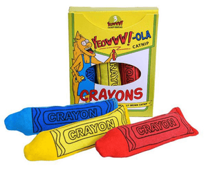 Yellow crayon-style box with cartoon cat pictured on the box with text that says 'Yeowww!-ola catnip' and 'crayons'. Three plush toy crayons lie in front, one blue, one red and one yellow. Pictured on a white background.