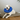 White dog with blue recovery cone
