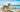 Dog on sandy beach with sea