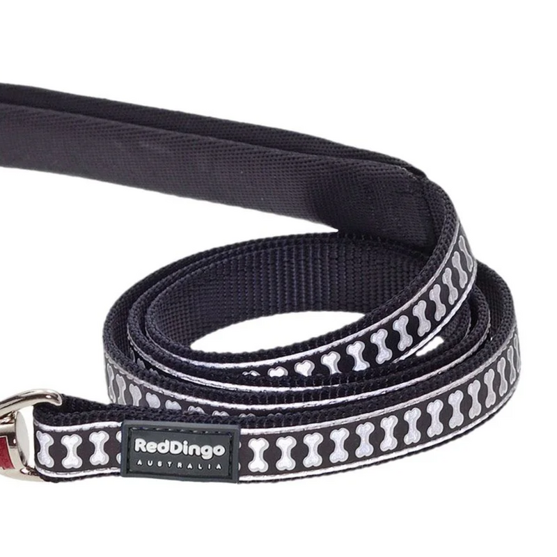 A close up of a Red Dingo Black Bones Dog Lead on a white background