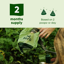 Beco dog waste bags with a person holding them outdoors, labeled for two months' supply based on daily use.