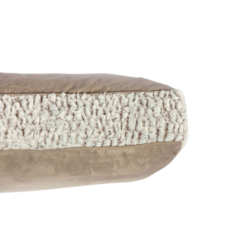 Close up of a side view of a pillow-type brown faux suede dog bed with faux fur trimming. 