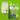 Two Arden Grange dog food packages on a bright green background, demonstrating the recent change in packaging.