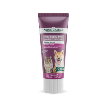A tube of Arden Grange Tasty Turkey Treat premium poultry paste dog and cat treats, featuring a purple and white design with images of a cat and a dog on the front.