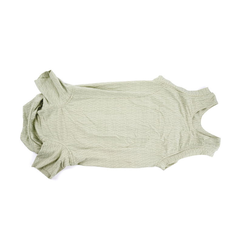 White background with a underneath view of a geometric green bodysuits for dogs pictured. 