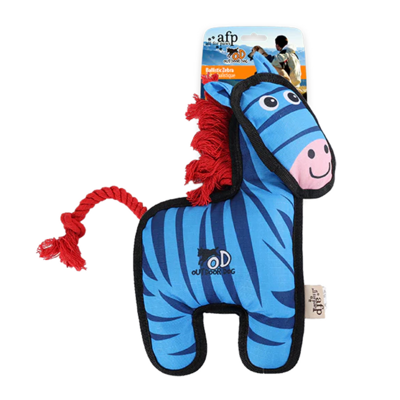 Blue Zebra dog toy with black trimming, a orange rope tail and mane with a pink muzzle which features a smile. Packaged on a backing card on a white background.