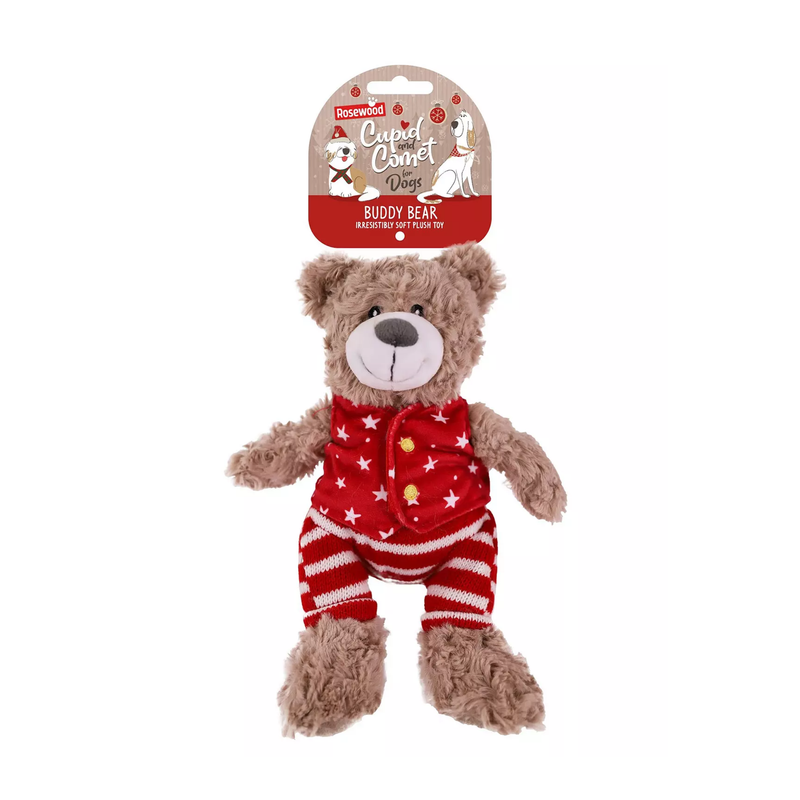 White background with a brown bear plush dog toy with red fabric with stars waist coat and red and white stripy trousers, a brown nose with stitched eye details, attached to a cardboard tag. 