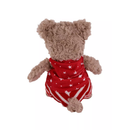 White background with a back view of a brown bear plush dog toy with red fabric with stars waist coat and red and white stripy trousers. 