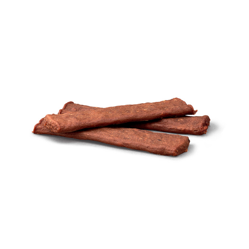 White background with 3 Crave Protein Strips in a pile. 