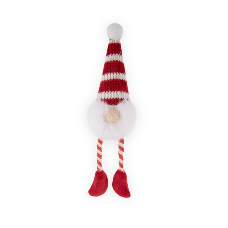 White background with a Gonk plush cat toy with red and white stripy hat and rope legs, with a white beard and white bobble hat.